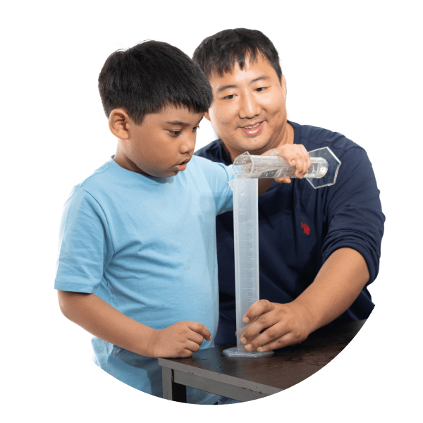 A man and a boy collaborate on a project, demonstrating teamwork and creativity in their work environment.